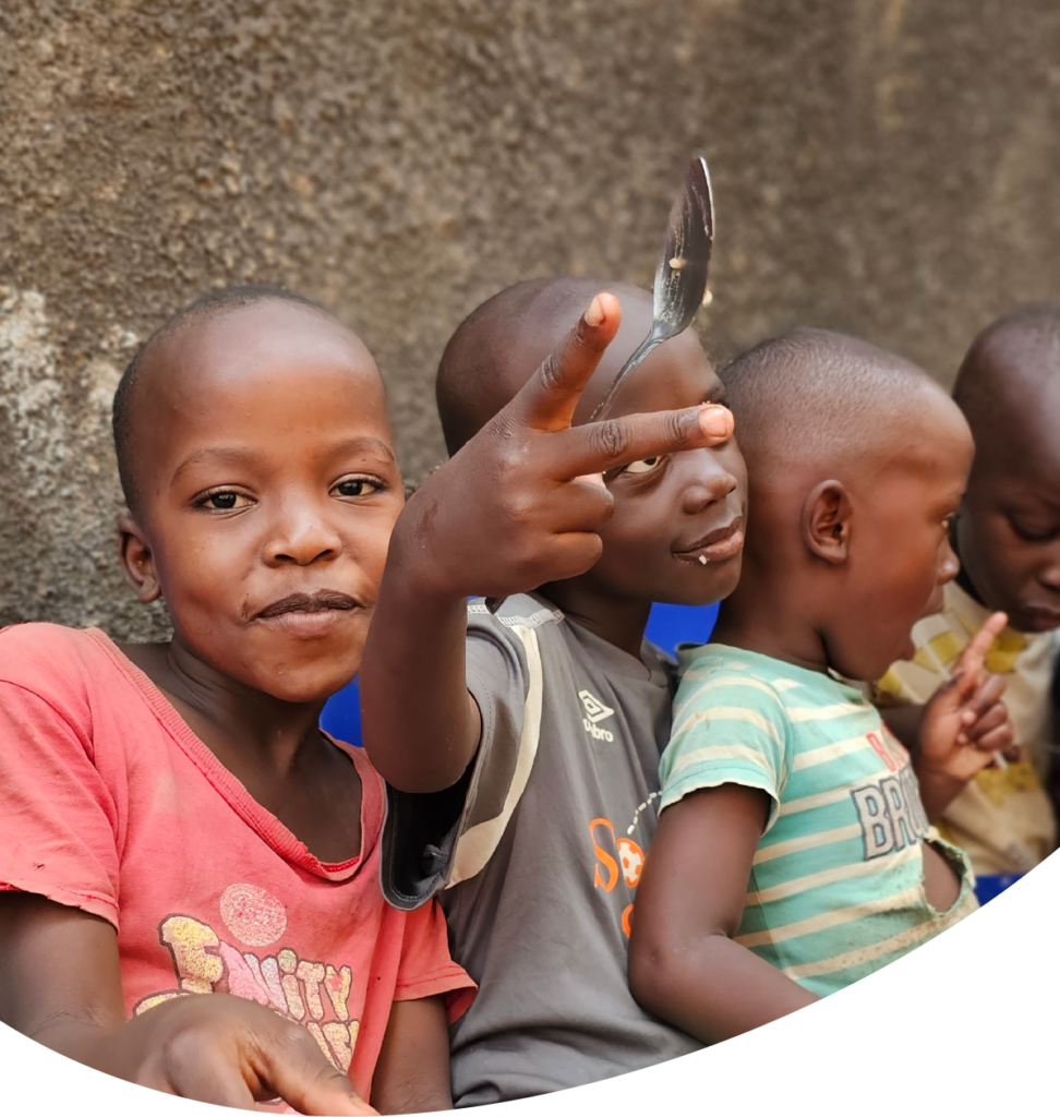 picture of a group of little boys eating and having fun