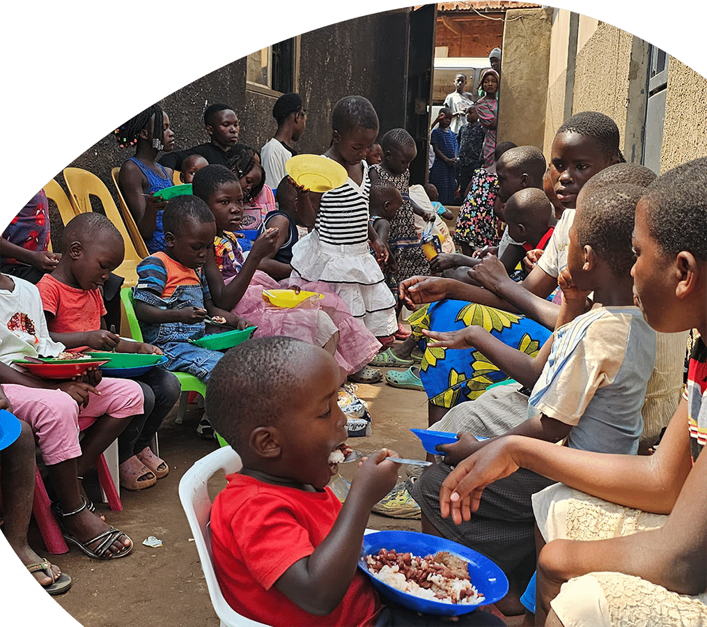 photo of a group of children eating together